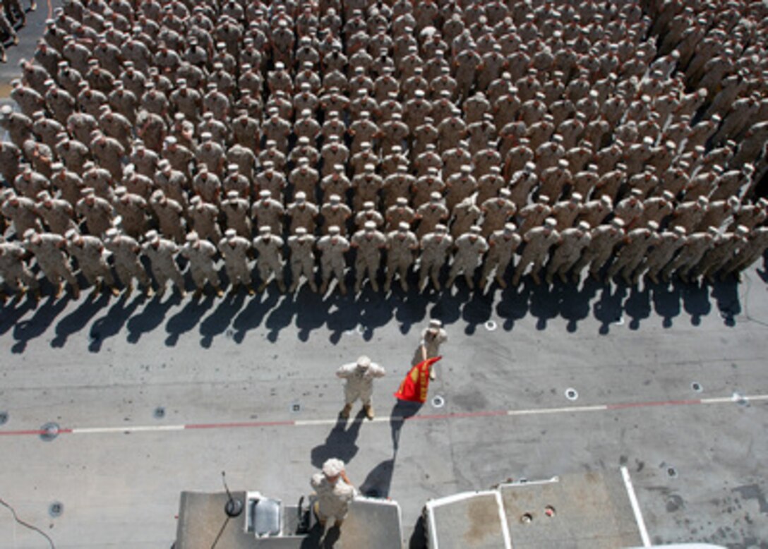 Commandant of the Marine Corps Gen. Michael Hagee addresses a formation of Marines and sailors on the flight deck of the amphibious assault ship USS Kearsarge (LHD 3) on June 17, 2005. Kearsarge and the embarked 26th Marine Expeditionary Unit (Special Operations Capable) are conducting Maritime Security Operations in the Persian Gulf. 