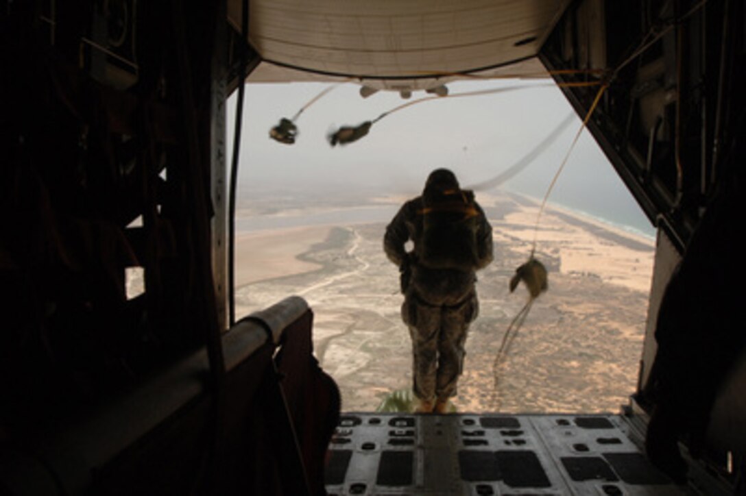Senegal Army soldiers and U.S. Army Special Operations Command-Europe soldiers perform a static-line parachute jump from an MC-130 Talon above Dakar, Senegal, during Exercise Flintlock '05 on June 18, 2005. Flintlock is a series of multi- national military exercises conducted throughout the Trans-Saharan region of Africa, with concentration on ground and air operations, land navigation, human rights training and collaboration between militaries. Algeria, Mali, Mauritania and Chad are participating in the exercise with Senegal and the U.S. 
