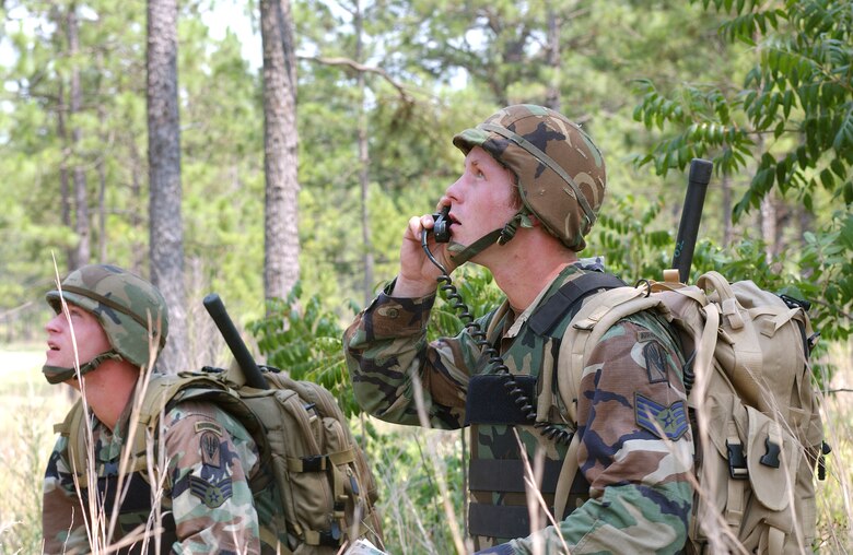 FORT POLK, La. -- Staff Sgt. Dan Kovarik (right) and Senior Airman Joshua Cullins guide an A-10 Thunderbolt II onto a target during a live-fire portion of Air Warrior II here.  The joint exercise trains Army units with embedded Air Force joint terminal attack controllers in a realistic battlespace.  Troops face a live enemy force, local role players and a variety of targets for air and ground forces.  (U.S. Air Force photo by Senior Airman Stephen Otero)