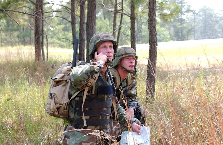 FORT POLK, La. -- Staff Sgt. Dan Kovarik (left) and Senior Airman Joshua Cullins guide an A-10 Thunderbolt II onto a target during a live-fire portion of Air Warrior II here.  The joint exercise trains Army units with embedded Air Force Joint terminal attack controllers in a realistic battlespace.  Troops face a live enemy force, local role players and a variety of targets for air and ground forces.  (U.S. Air Force photo by Senior Airman Stephen Otero)