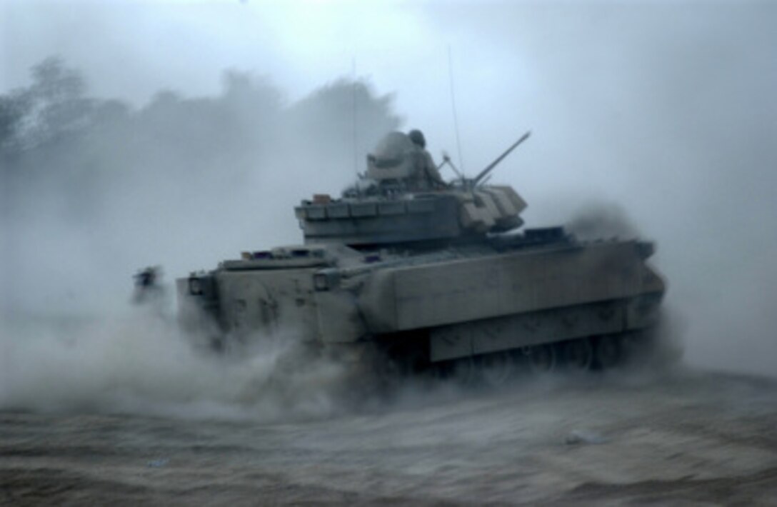 U.S. Army Task Force 1/156th (M), 256th Brigade Combat Team, 3rd Infantry Division, moves out from Camp Liberty in Baghdad, Iraq, to confront anti-Iraqi forces, on June 15, 2005. 