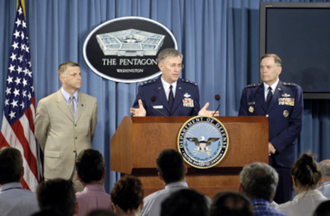 Acting Secretary of the Air Force Michael Dominguez (left) and Air Force Chief of Staff Gen. John Jumper (right) look on as Air Force Deputy Chief of Staff for Personnel Lt. Gen. Roger Brady (center) talks about his investigation into the religious climate at the U.S. Air Force Academy during a Pentagon press briefing on June 22, 2005. 