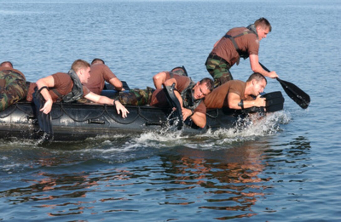 Trainees from the U.S. Air Force Advanced Skills Training struggle to paddle their rubber raiding craft during the intense physical competition known as a Monster Mash at Hurlburt Field, Fla., on June 9, 2005. Monster Mash pits different classes of Combat Controller students against each other every few months as part of their intense physical training. 