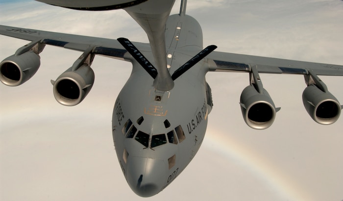 OVER THE PACIFIC -- A C-17 Globemaster III approaches a KC-135 Stratotanker to practice air-to-air refueling during a local training mission recently.  The C-17 is on loan to the 15th Airlift Wing at Hickam Air Force Base, Hawaii, from the 437th AW at Charleston AFB, S.C.  The KC-135 is assigned to the Hawaii Air National Guard's 203rd Air Refueling Squadron.  (U.S. Air Force photo by Tech. Sgt. Shane A. Cuomo)