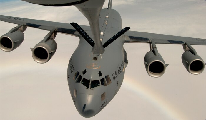 OVER THE PACIFIC -- A C-17 Globemaster III approaches a KC-135 Stratotanker to practice air-to-air refueling during a local training mission recently.  The C-17 is on loan to the 15th Airlift Wing at Hickam Air Force Base, Hawaii, from the 437th AW at Charleston AFB, S.C.  The KC-135 is assigned to the Hawaii Air National Guard's 203rd Air Refueling Squadron.  (U.S. Air Force photo by Tech. Sgt. Shane A. Cuomo)