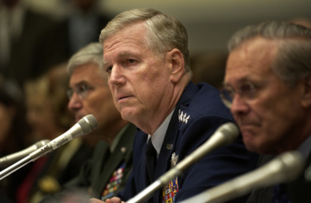 Chairman of the Joint Chiefs of Staff Gen. Richard Myers (center) U.S. Air Force, listens to a question during a House Armed Services Committee hearing on the U.S. military strategy in Iraq on Capitol Hill in Washington, D.C., on June 23, 2005. Secretary of Defense Donald Rumsfeld (right), U.S. Central Command Commander Gen. John Abizaid, U.S. Army, and Commanding General of Multi-National Forces in Iraq Gen. George Casey (left), U.S. Army, joined in testifying before the committee. 