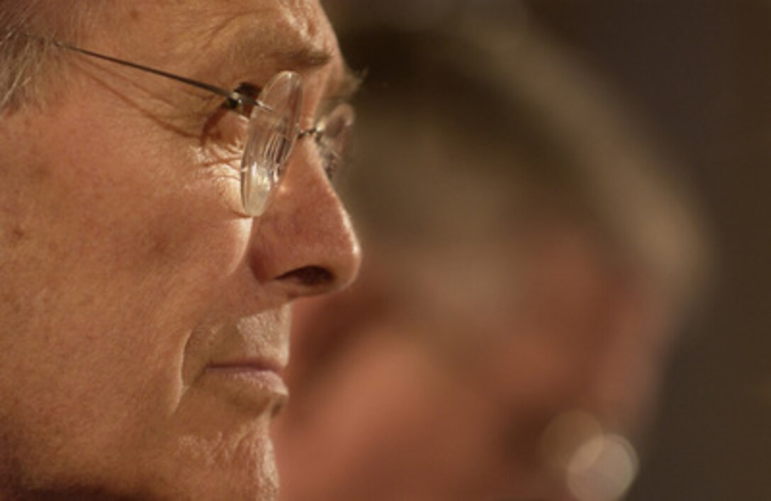 Secretary of Defense Donald H. Rumsfeld listens to a question during a Senate Armed Services Committee hearing on the U.S. military strategy in Iraq on Capitol Hill in Washington, D.C., on June 23, 2005. 
