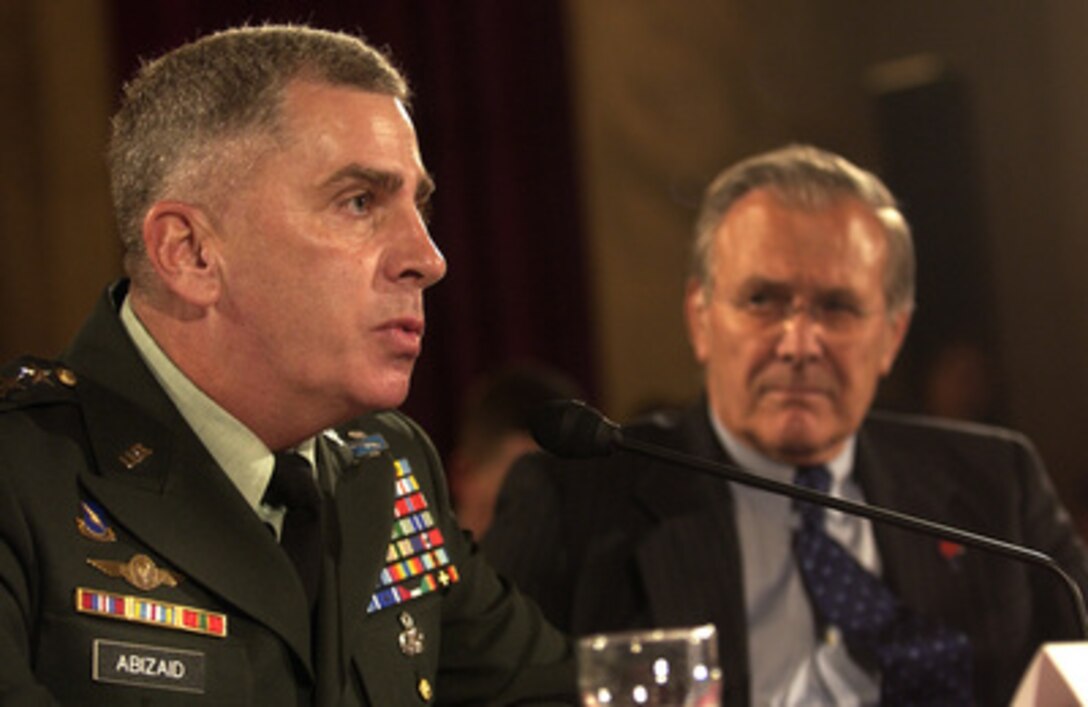 U.S. Central Command Commander Gen. John Abizaid (left), U.S. Army, testifies before the Senate Armed Services Committee on the progress of Iraqi security forces during a hearing on Capitol Hill in Washington, D.C., on June 23, 2005. Abizaid accompanied Secretary of Defense Donald Rumsfeld (right), Chairman of the Joint Chiefs of Staff Gen. Richard Myers, U.S. Air Force, and Commanding General of Multi-National Forces in Iraq Gen. George Casey Jr., U.S. Army, in testifying before the committee. 