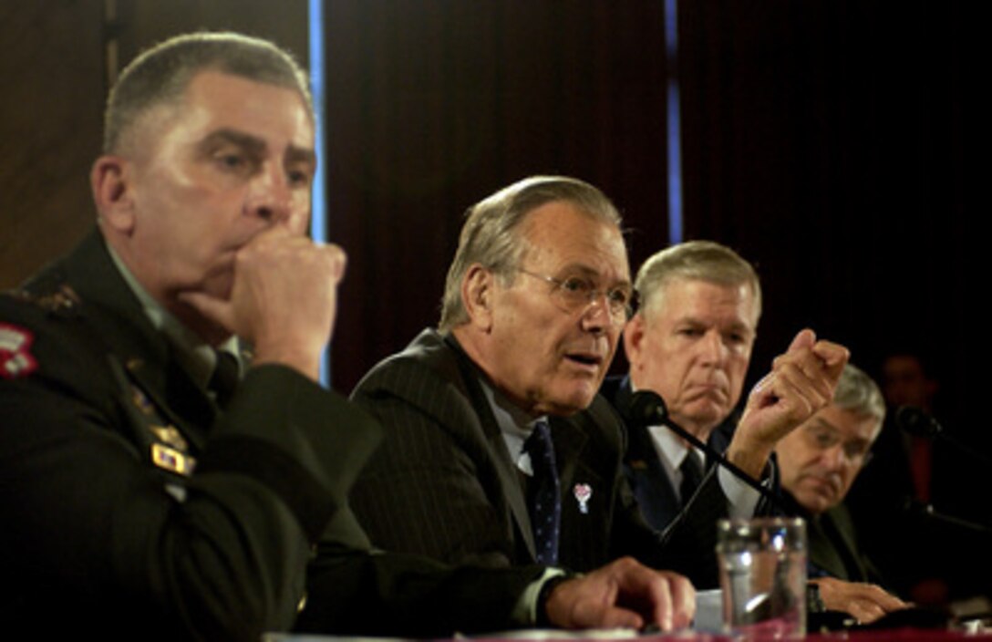 Secretary of Defense Donald H. Rumsfeld responds to a senator's question during a Senate Armed Services Committee hearing on the U.S. military strategy in Iraq on Capitol Hill in Washington, D.C., on June 23, 2005. U.S. Central Command Commander Gen. John Abizaid (left), U.S. Army, Chairman of the Joint Chiefs of Staff Gen. Richard Myers (2nd from right), U.S. Air Force, and Commanding General of Multi-National Forces in Iraq Gen. George Casey Jr. (right), U.S. Army, joined in testifying before the committee. 