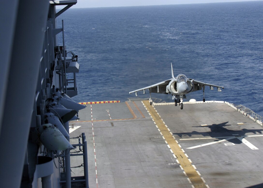An AV-8B Harrier from Marine Attack Squadron 223 lands onboard the USS NASSAU after flight training during the Expeditionary Strike Group Interoperability Exercise (ESGINT) conducted by the 22nd Marine Expeditionary Unit (MEU) from June 23-30, 2005.  ESGINT is one of many training evolutions conducted by the 22nd MEU in preparation for it's deployment later this year.  (Official U.S. Marine Corps Photo by Sgt. Robert A. Sturkie)