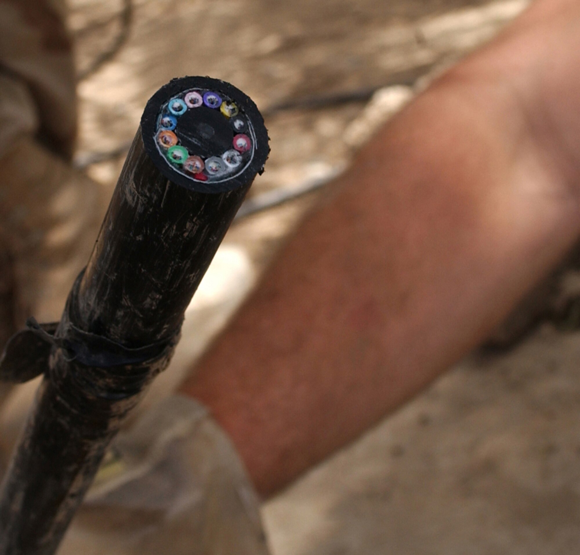 BAGHDAD, Iraq -- More than 22 miles of 144-strand fiber optic cable will be installed here to provide state-of-the-art communication among coalition compounds.  Each fiber optic strand is made of optically pure glass and is thinner than a human hair.  (U.S. Air Force photo by Tech. Sgt. Brian Davidson)                    