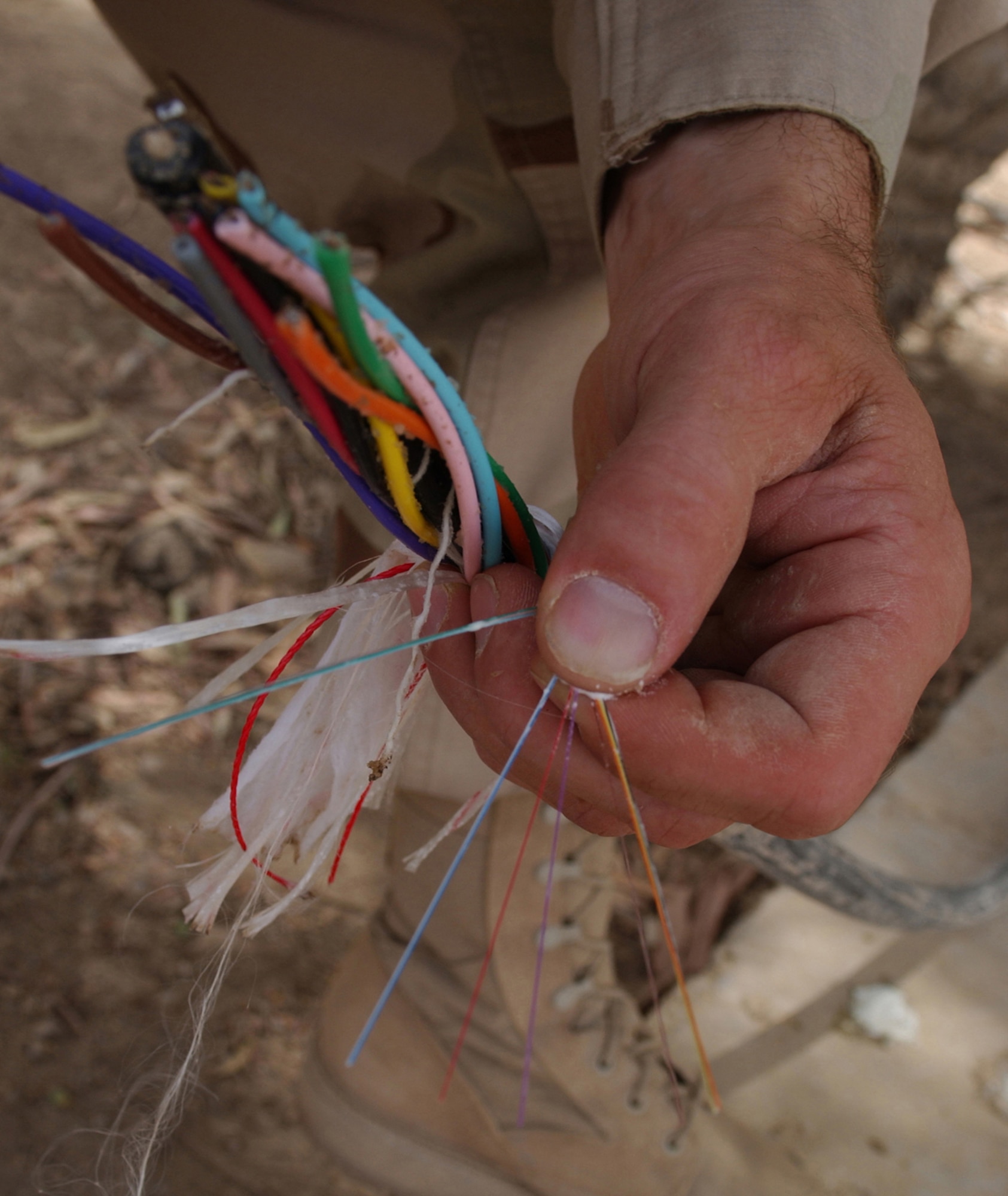 BAGHDAD, Iraq -- More than 22 miles of 144-strand fiber optic cable will be installed here to provide state-of-the-art communication among coalition compounds.  Each fiber optic strand is made of optically pure glass and is thinner than a human hair.  (U.S. Air Force photo by Tech. Sgt. Brian Davidson)                       
