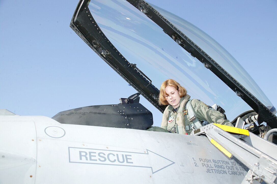 SHAW AIR FORCE BASE, S.C. -- Capt. Gina Jennings prepares to fly an F-16 Fighting Falcon with the 79th Fighter Squadron.  She is assigned to the 20th Operations Support Squadron here and is deployed supporting Operation Iraqi Freedom.  (U.S. Air Force photo by Senior Airman Susan Penning)