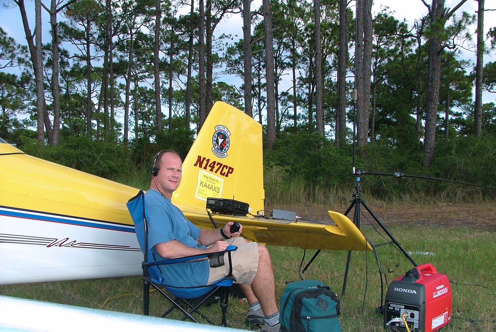 DOG ISLAND, Fla. -- Lt. Col. Edward Linch attempts to contact another amateur radio operator during Field Day 2005.  The nationwide event is held by the American Radio Relay League to link amateur stations with federal, state and local disaster relief agencies.  Colonel Linch flew his private plane here -- an island with no permanent residents or formal airfield -- establishing a link to 36 other operators during extremely poor atmospheric conditions.  He is the wing plans chief of the 505th Command and Control Wing at nearby Hurlburt Field.  (U.S. Air Force photo)
