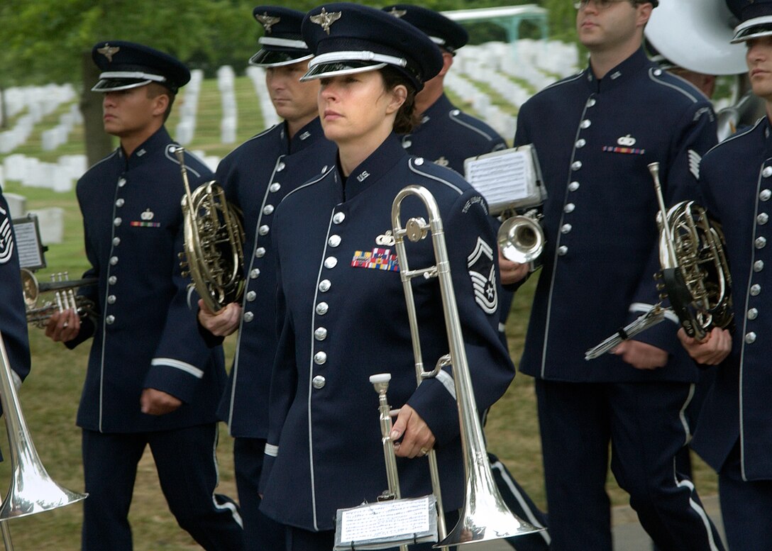 ARLINGTON, Va. -- Senior Master Sgt. Ann Highnote marches with the U.S. Air Force Band's ceremonial brass unit at Arlington National Cemetery.  She is the band's superintendent and was recently selected as the recipient of the 2005 U.S. Armed Forces Spirit of Hope Award for the Air Force.  (U.S. Air Force photo by Senior Airman Casey McCormick)               