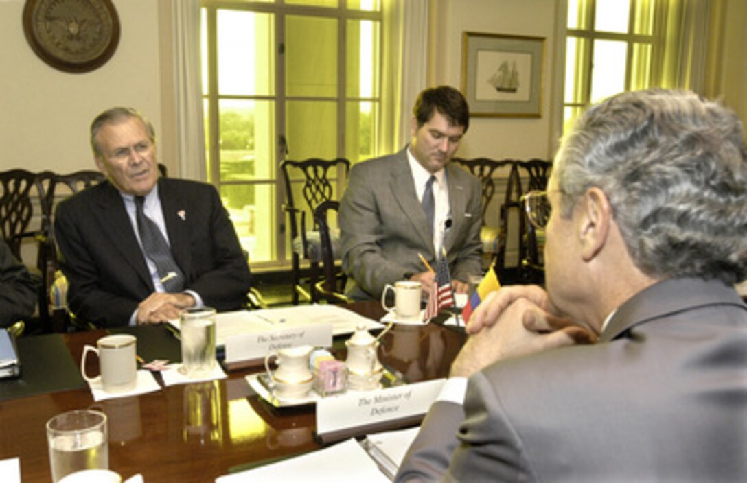 Secretary of Defense Donald H. Rumsfeld (left) hosts a Pentagon meeting with Colombian Minister of Defense Jorge Uribe (foreground) on June 27, 2005, to discuss a range of bilateral and regional security issues. Joining Rumsfeld on the U.S. side of the table is Deputy Assistant Secretary of Defense for Western Hemisphere Affairs Ricardo Pardo-Mauer (center). 