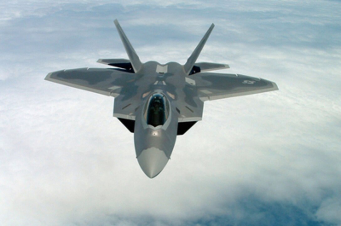 A U.S. Air Force F-22 Raptor prepares to rendezvous with a KC-135R Stratotanker for in-flight refueling in a training area over the Atlantic Ocean off the Virginia coast on June 21, 2005. The Raptor, which is the first stealth supersonic fighter in the world, is attached to the 1st Fighter Training Squadron, Langley Air Force Base, Va. The Stratotanker is from the 99th Air Refueling Squadron, Robins Air Force Base, Ga. 