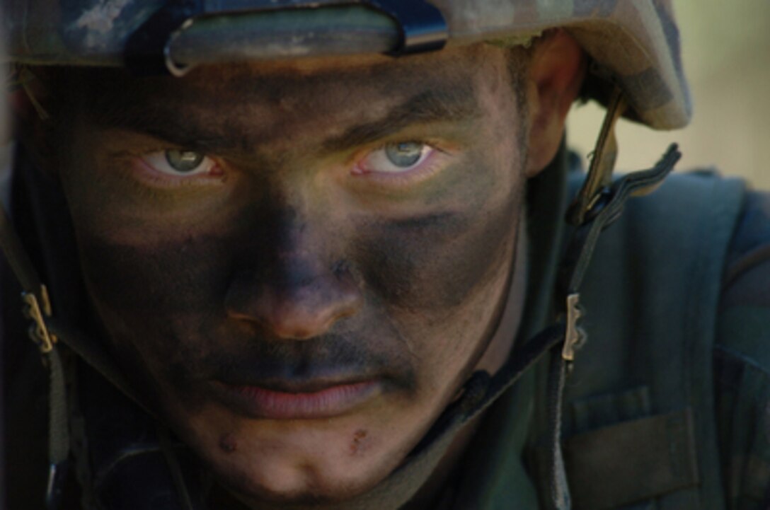 U.S. Army Pfc. Justin Drake maintains a defensive position at the rear of a Humvee while in a simulated battle during Exercise Talisman Sabre at Shoalwater Bay Training Area, Queensland, Australia, on June 25, 2005. Talisman Saber is a combined U.S.-Australia command post and field training exercise, demonstrating the U.S. and Australian commitment to the military alliance and regional security. More than 17,000 Army, Navy, Air Force, Marine and Special Forces personnel are participating in the exercise. Drake is assigned to the 501st Airborne Division, Delta Company, Heavy Weapons and Anti-tank unit. 