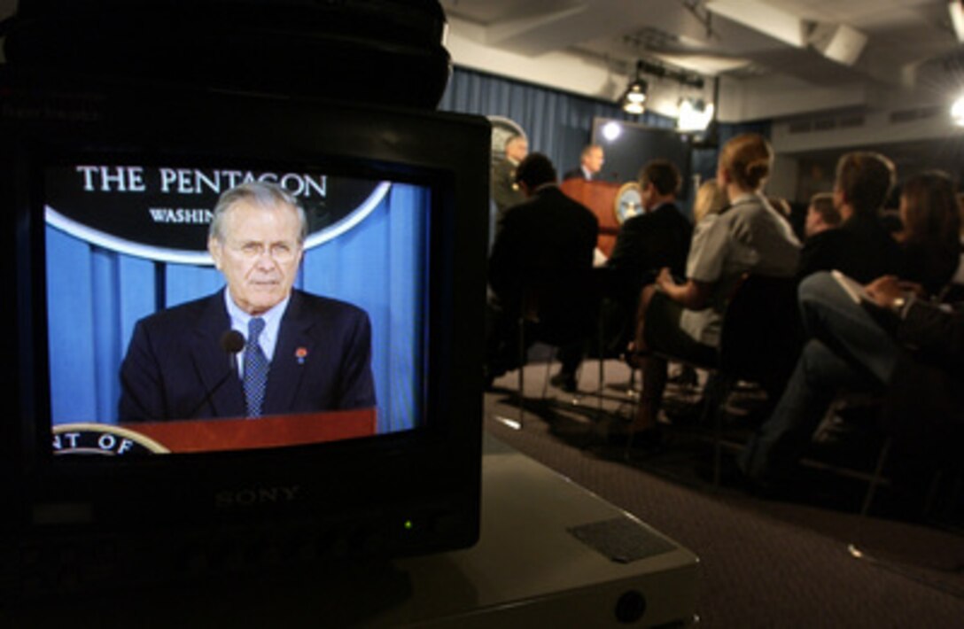 A television monitor in the Pentagon Briefing Room shows Secretary of Defense Donald H. Rumsfeld as he responds to reporter's question during a press conference with Commander, Multi-National Force-Iraq Gen. George W. Casey Jr., U.S. Army, in the Pentagon on June 27, 2005. Rumsfeld and Casey fielded questions from reporters on the U.S. military strategy and operations in Iraq. 