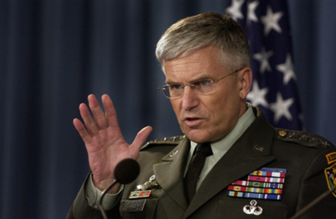 Commander, Multi-National Force-Iraq Gen. George W. Casey Jr., U.S. Army, gestures to a make point as he answers a reporter's question during a press conference with Secretary of Defense Donald H. Rumsfeld in the Pentagon on June 27, 2005. Rumsfeld and Casey fielded questions from reporters on the U.S. military strategy and operations in Iraq. 