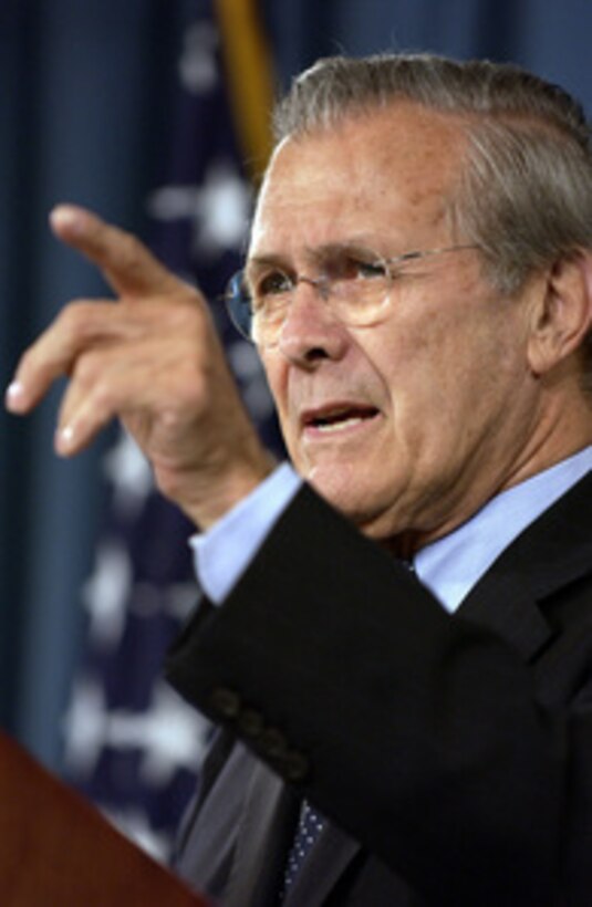 Secretary of Defense Donald H. Rumsfeld calls on a reporter during a press conference with Commander, Multi-National Force-Iraq Gen. George W. Casey Jr., U.S. Army, in the Pentagon on June 27, 2005. Rumsfeld and Casey fielded questions from reporters on the U.S. military strategy and operations in Iraq. 