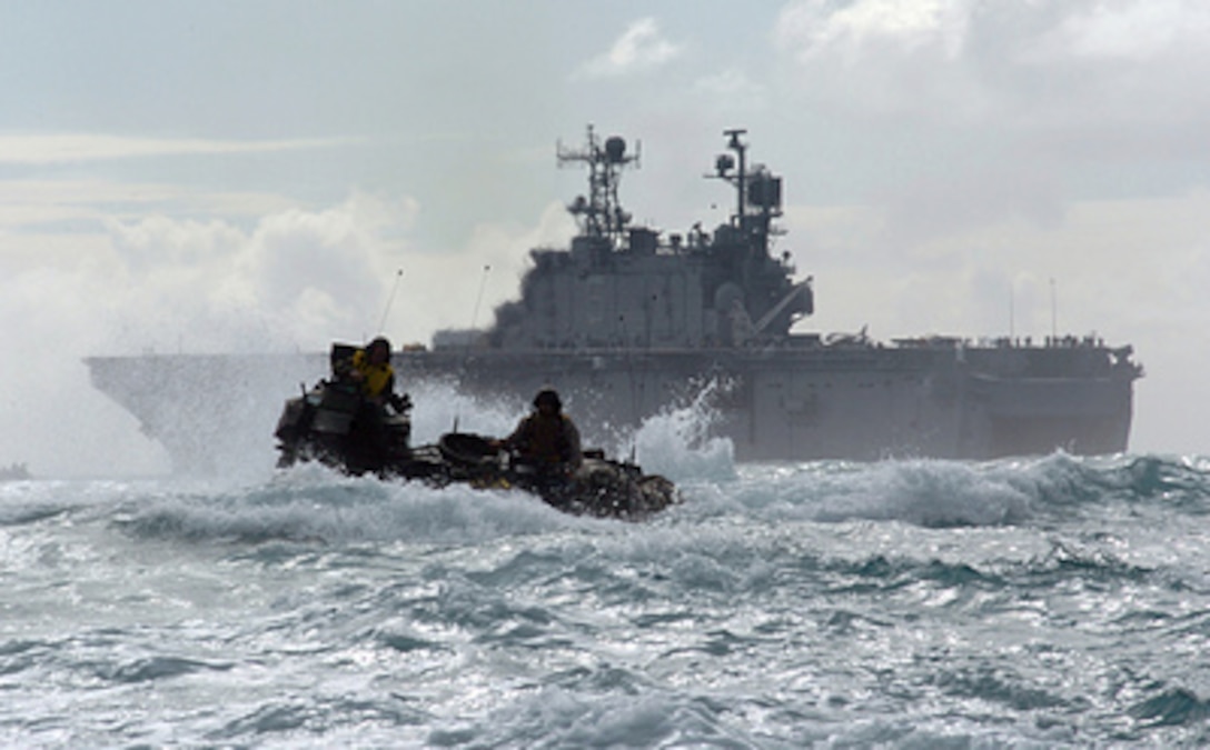 A U.S. Marine Corps amphibious assault vehicle travels through the Pacific Ocean after departing the amphibious assault ship USS Peleliu (LHA 5) on June 27, 2005. Marines of the 3rd Amphibious Assault Battalion are going ashore at Marine Corps Training Area Bellows, Hawaii, to conduct infantry and amphibious training. 