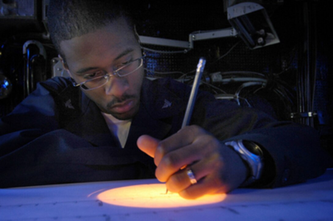 Navy Petty Officer 3rd Class Zill Sanders plots the location and bearing of ships in the vicinity of the aircraft carrier USS Kitty Hawk (CV 63) on June 28, 2005. The Kitty Hawk is currently operating in the Coral Sea off the coast of Australia's Queensland region as part of Exercise Talisman Saber 2005. Talisman Saber is a combined U.S.-Australia command post and field training exercise, demonstrating the U.S. and Australian commitment to the military alliance and regional security. More than 17,000 Army, Navy, Air Force, Marine and Special Forces personnel are participating in the exercise. Sanders, a Navy Operations Specialist, monitors radar, navigation and communication equipment in the ship's command direction center and bridge. 
