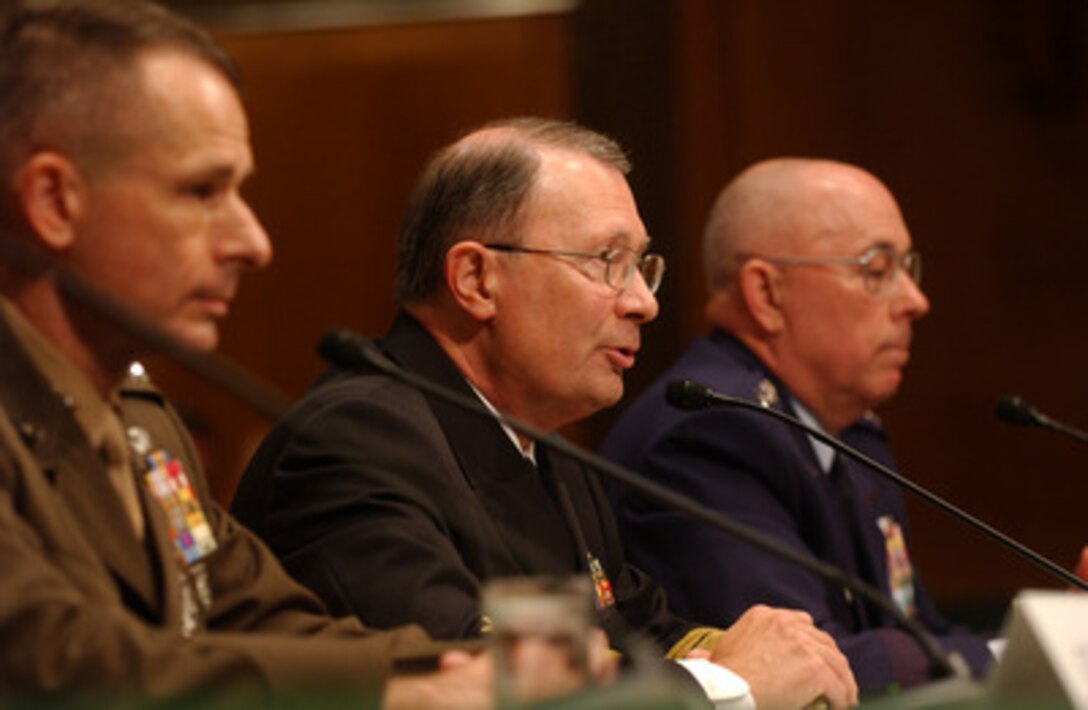 Navy Adm. Edmund P. Giambastani Jr. (center) responds to a question from a senator at the Senate Armed Services Committee hearing on his nomination to become the next Vice Chairman of the Joint Chiefs of Staff in Washington, D.C., on June 29, 2005. Giambastani is flanked by the current Vice Chairman of the Joint Chiefs of Staff Gen. Peter Pace, U.S. Marines Corps, and Air Force Gen. T. Michael Moseley. Pace has been nominated to become the Chairman of the Joint Chiefs of Staff and Moseley has been nominated for the position of Chief of Staff of the Air Force. 