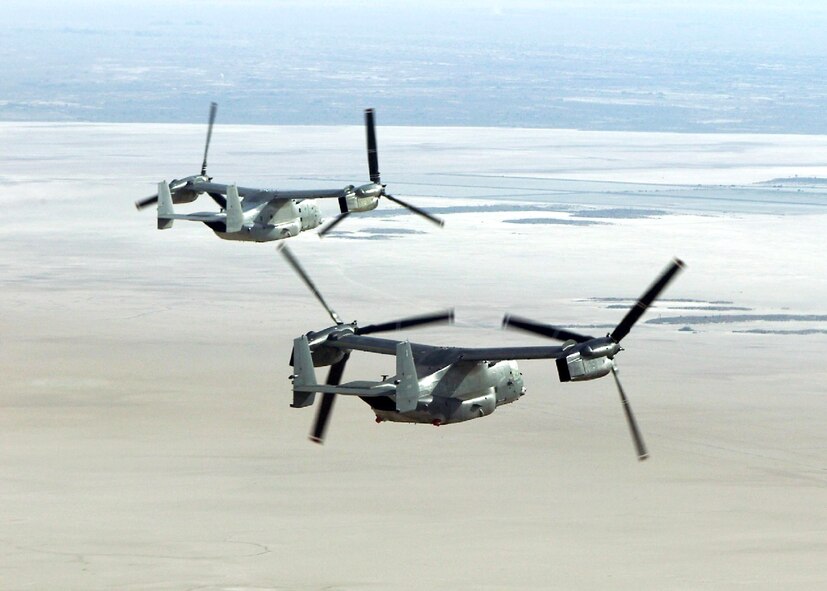 OVER EDWARDS AIR FORCE BASE, Calif. -- The first two Air Force CV-22 Osprey test aircraft fly in formation here.  A third Osprey arrived at the base Feb. 26.  (U.S. Air Force photo by James Haseltine)