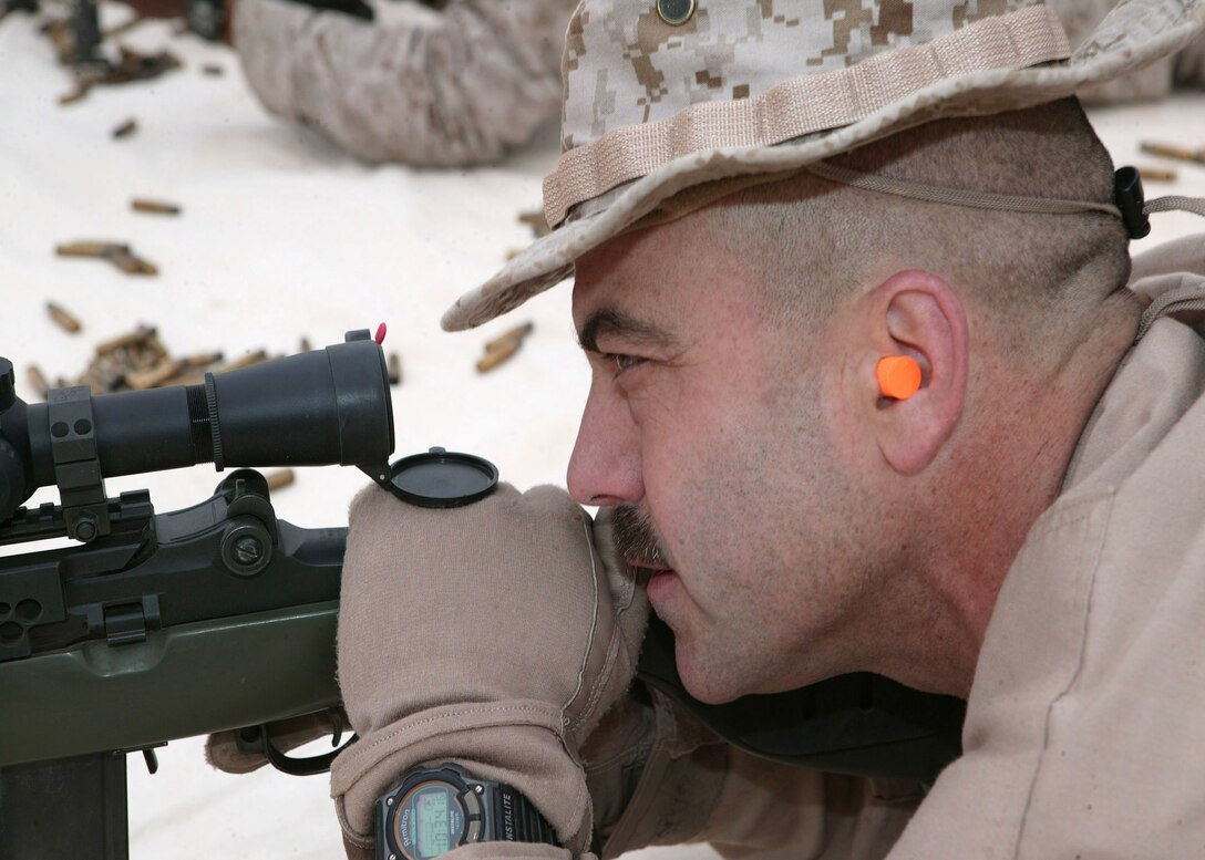 Chief Warrant Officer Bradley A. Garfield, officer in charge of Marine Wing Support Squadron 271's Explosive Ordnance Disposal and native of Colchester, Vt., sights in on the target with a Designated Marksmanship Rifle during a rifle zeroing exercise. The EOD technicians are thoroughly trained in how to incorporate high-powered rifles into their arsenal of tools to combat explosive devices.