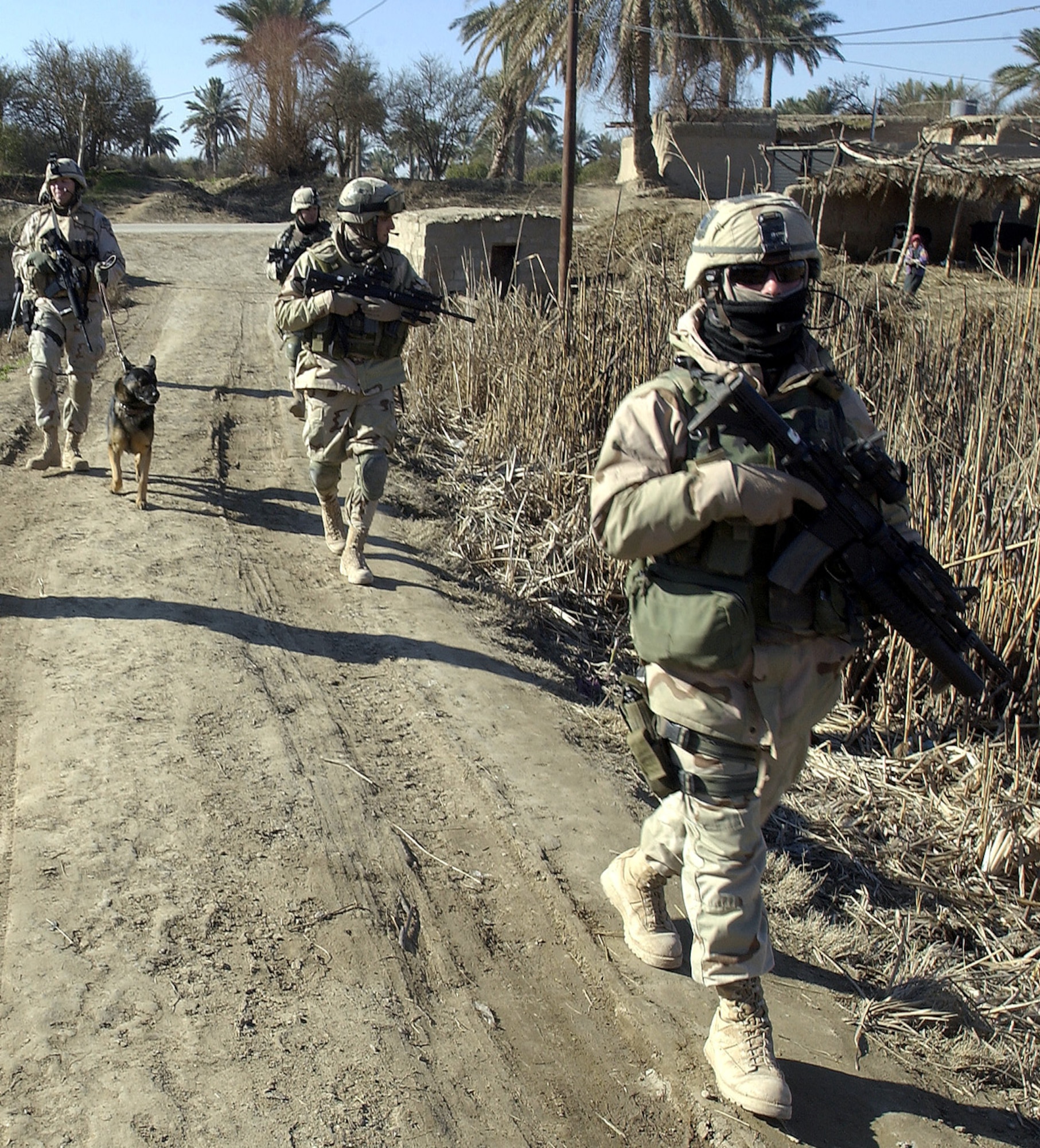 NEAR BALAD AIR BASE, Iraq -- Airmen of Task Force 1041 patrol the local area.  The task force is a self-sustaining unit and has medical staff, personnelists, information managers and other specialists who are all trained to be defenders.  (U.S. Air Force photo by Tech. Sgt. Mike Buytas)
