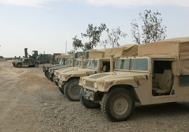 Humvees and forklifts are just some of the equipment that Headquarters and Service Battalion, 2d Force Service Support Group (Forward) motor pool is responsible for maintaining.  (Photo by Cpl. C.J. Yard)