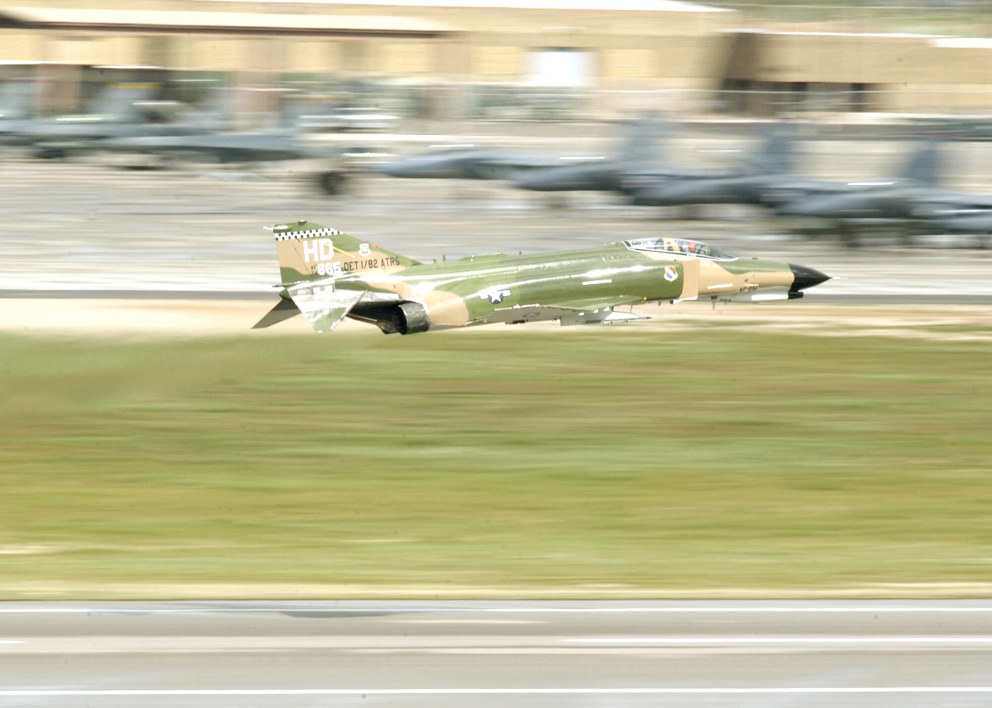 DAVIS-MONTHAN AIR FORCE BASE, Ariz. -- An F-4 Phantom II takes off while participating in the 2005 Heritage Flight Conference here.  The Heritage Flight program was established in 1997 supporting the Air Force's 50th anniversary.  It involves today's state-of-the-art fighters flying in close formation with World War II and Korean War vintage fighters.  The flight is designed to safely display the evolution of U.S. Air Force airpower and support Air Force's recruiting and retention efforts.  (U.S. Air Force photo by Tech. Sgt. Jeremiah Erickson)