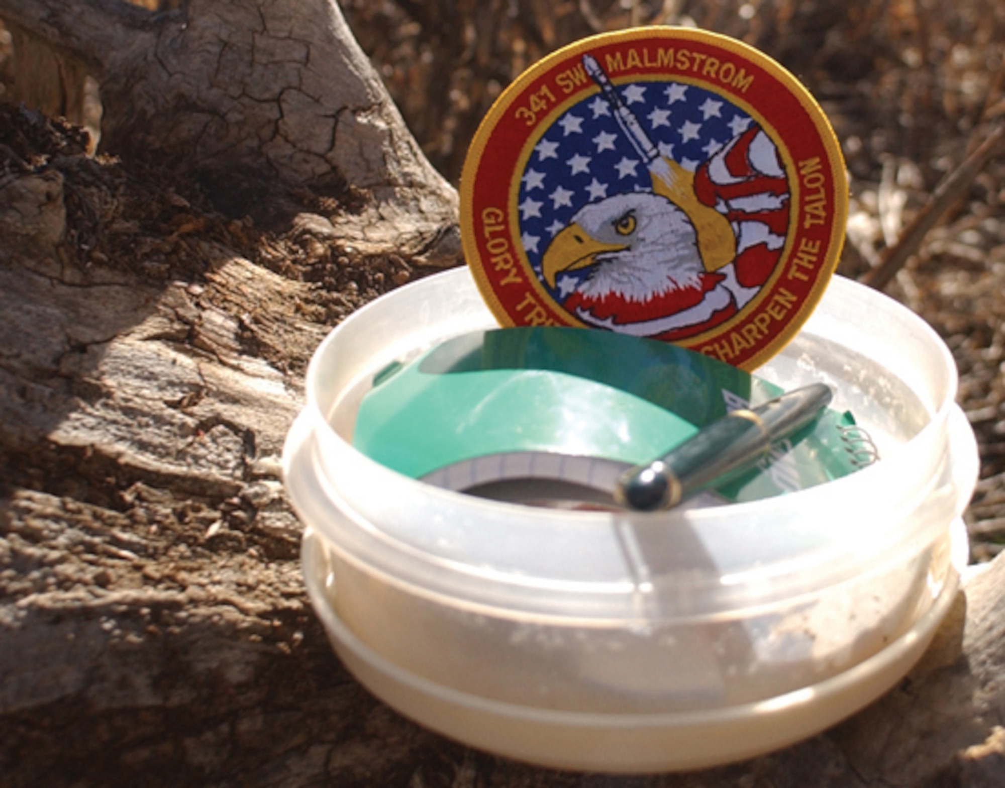 MONTANA -- Thanks to the Global Positioning System and inexpensive GPS receivers, the sport of geocaching is growing.  Most caches contain a log book, pencil and small trinkets for trade.  (U.S. Air Force photo by Senior Airman John Parie)