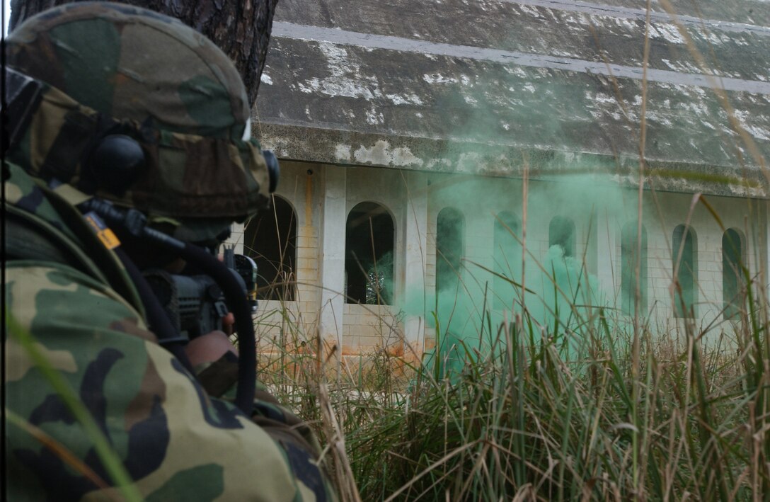CAMP SCHWAB, Japan -- Senior Airman Kimwa Edwards watches for enemy movement during an urban warfare field training exercise here Feb. 18. He is a security forces Airman with the 18th Security Forces Squadron. (U.S. Air Force photo by Airman Gary Edwards)