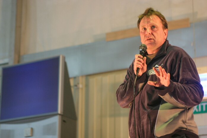 Comedian Colin Quinn performs part of his stand-up comdedy routine for service members at Camp Taqaddum, Iraq.   "Bringing up the Rear," a comedy tour put together by the United Services Organizations and Armed Forces Entertainment is a ten-day tour.