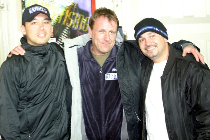 Comedians Colin Quinn, Robert Kelley and Steve Byrne entertained the service members aboard Camp Taqaddum, Iraq.  The comedians were brought here by the United Services Organization and Armed Forces Entertainment, and are part of a ten-day tour.  (Photo by Cpl. C.J. Yard)