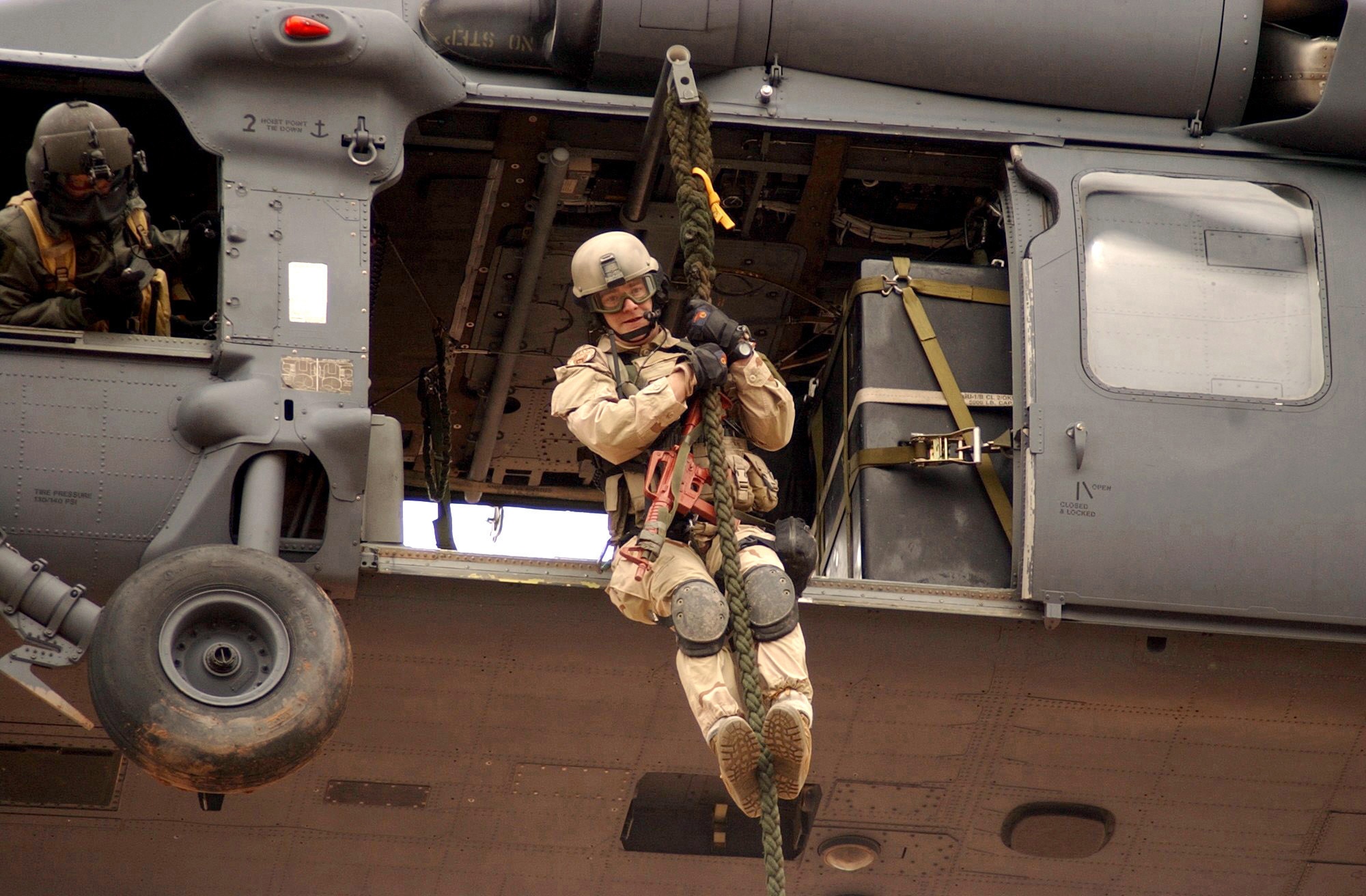 DAVIS-MONTHAN AIR FORCE BASE, Ariz. -- Senior Airman Josiah Blanton, a pararescueman, fast ropes from a HH-60G Pave Hawk. Pararescuemen are specifically trained and equipped to conduct conventional or unconventional rescue operations. Their motto &quot;That Others May Live&quot; reaffirms the pararescueman's commitment to saving lives and self-sacrifice. (U.S. Air Force photo by Master Sgt. Ruby Zarzyczny)