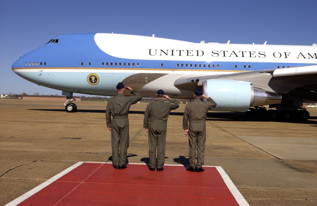 BARKSDALE AIR FORCE BASE, La. -- Base leaders here bid farewell to President George W. Bush as Air Force One prepares to depart.  They are (from left) Col. Michael Moeller, 2nd Bomb Wing commander; Brig. Gen. Jack Ihile, 917th Wing commander; and Lt. Gen. Bruce Carlson, 8th Air Force commander.  President Bush had attended a town hall meeting in nearby Shreveport on March 11.  (U.S. Air Force photo by Master Sgt. Michael A. Kaplan) 