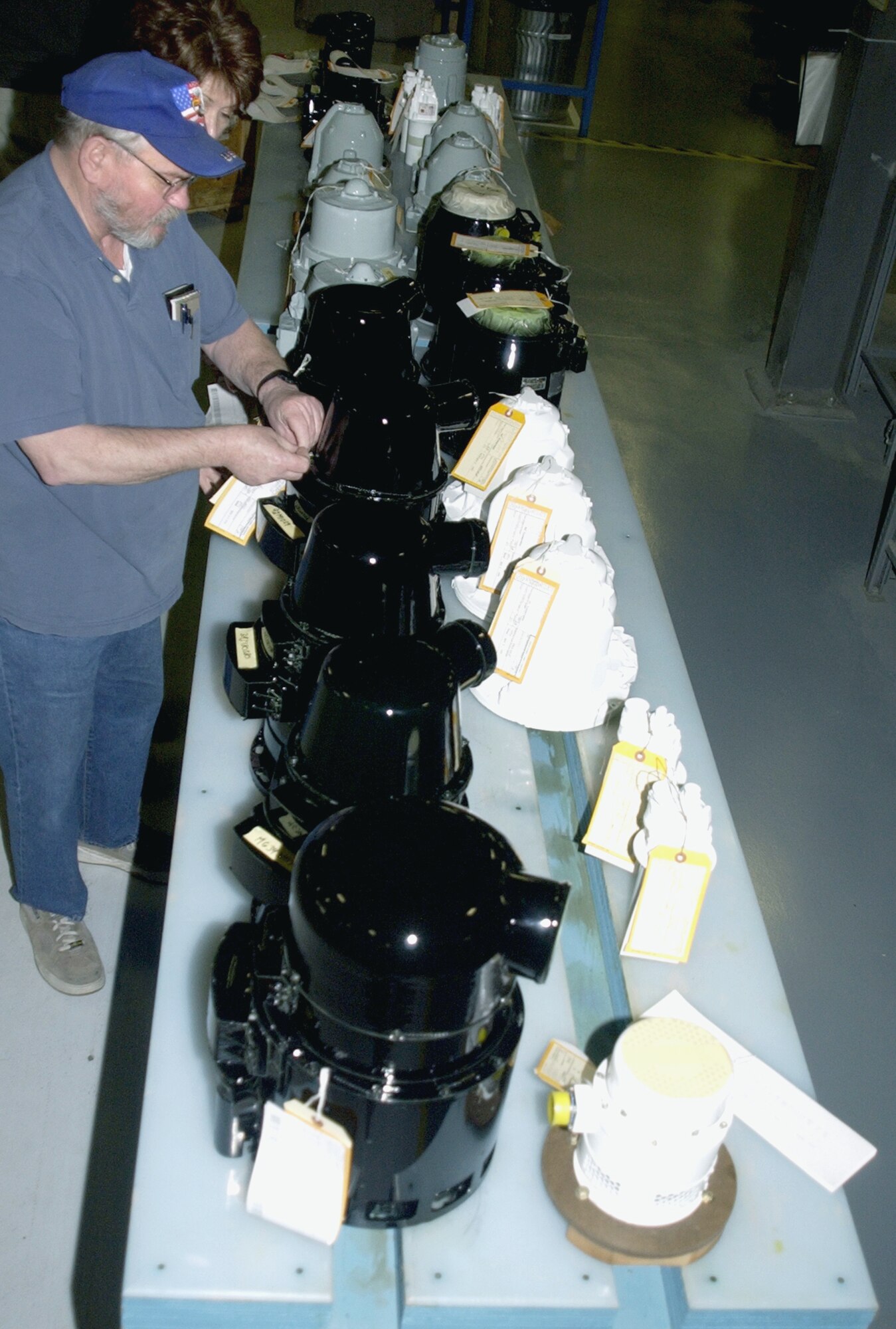 HILL AIR FORCE BASE, Utah -- Rows of finished products are tagged by employees before being shipped to their new aircraft.  Workers of the 309th Generator Squadron's airborne flight restore more than 4,200 aircraft generators a year.  (U.S. Air Force photo by Beth Young)