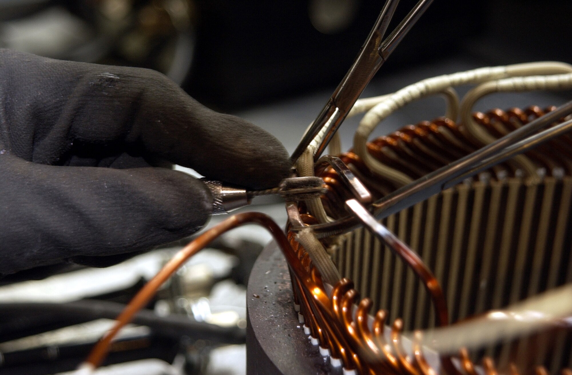 HILL AIR FORCE BASE, Utah -- Before brazing the coil leads of a KC-135 Stratotanker generator, they must be carefully cleaned.  Workers in the 309th Generator Squadron's airborne flight restore generators from all types of aircraft, including some from other branches of the service.  (U.S. Air Force photo by Beth Young)