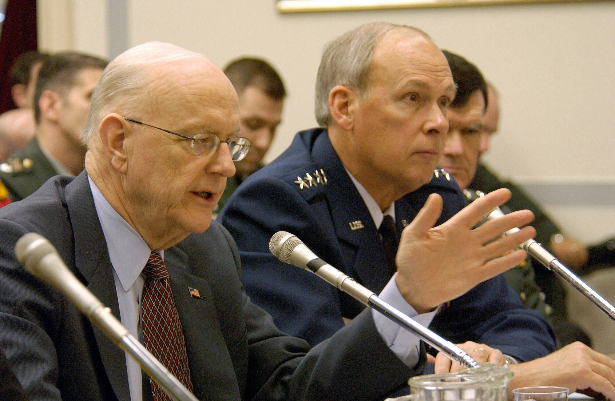 WASHINGTON -- Peter B. Teets, acting secretary of the Air Force, and General Lance W. Lord, commander of Air Force Space Command, testify before members of the House Armed Services Committee subcommittee on strategic forces about the fiscal 2006 budget for space operations.  (U.S. Air Force photo by Master Sgt. Gary R. Coppage)