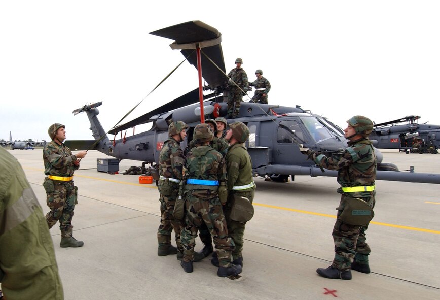MOODY AIR FORCE BASE, Ga. -- Airmen work on an HH-60G Pave Hawk helicopter during the kick-off of the 347th Rescue Wing's operational readiness inspection.  The Air Force's only combat search and rescue wing is undergoing its first ORI since transitioning to Air Force Special Operations Command in 2003.  (U.S. Air Force photo by Airman 1st Class Joshua Jasper)