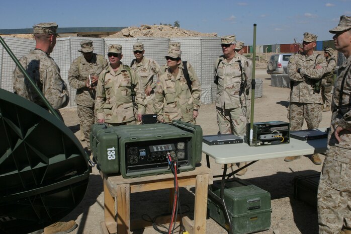 Lieutenant Gen. Duncan J. McNabb, director for the Logistics, the Joint Staff receives a brief from the Marines from the Supply Management Unit from Combat Logistics Regiment 25 about the new In-transit Visibility System the Marine Corps is using to track gear.  "What we're doing here is a key enabler to true logistics transformation which translates directly into war-fighting effect," said McNabb.