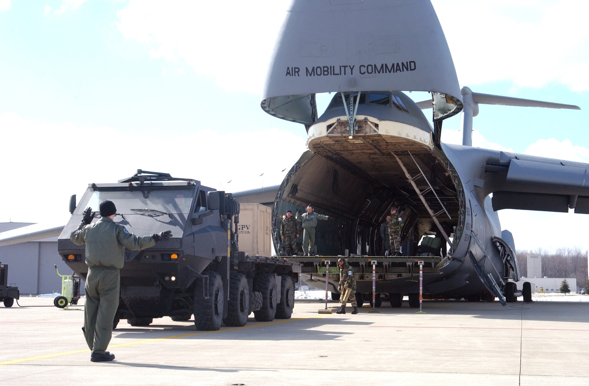 SELFRIDGE AIR NATIONAL GUARD BASE, Mich. -- A C-5 Galaxy undergoes loading and unloading trials with the Army's prototype general purpose vehicle here.  The exercise follows earlier tests of the vehicle on a C-130 Hercules from the 171st Airlift Squadron based here.  The C-5 is from Dover Air Force Base, Del., with a mixed crew of active-duty and Reserve Airmen.  (U.S. Air Force photo by Master Sgt. Clancey Pence)