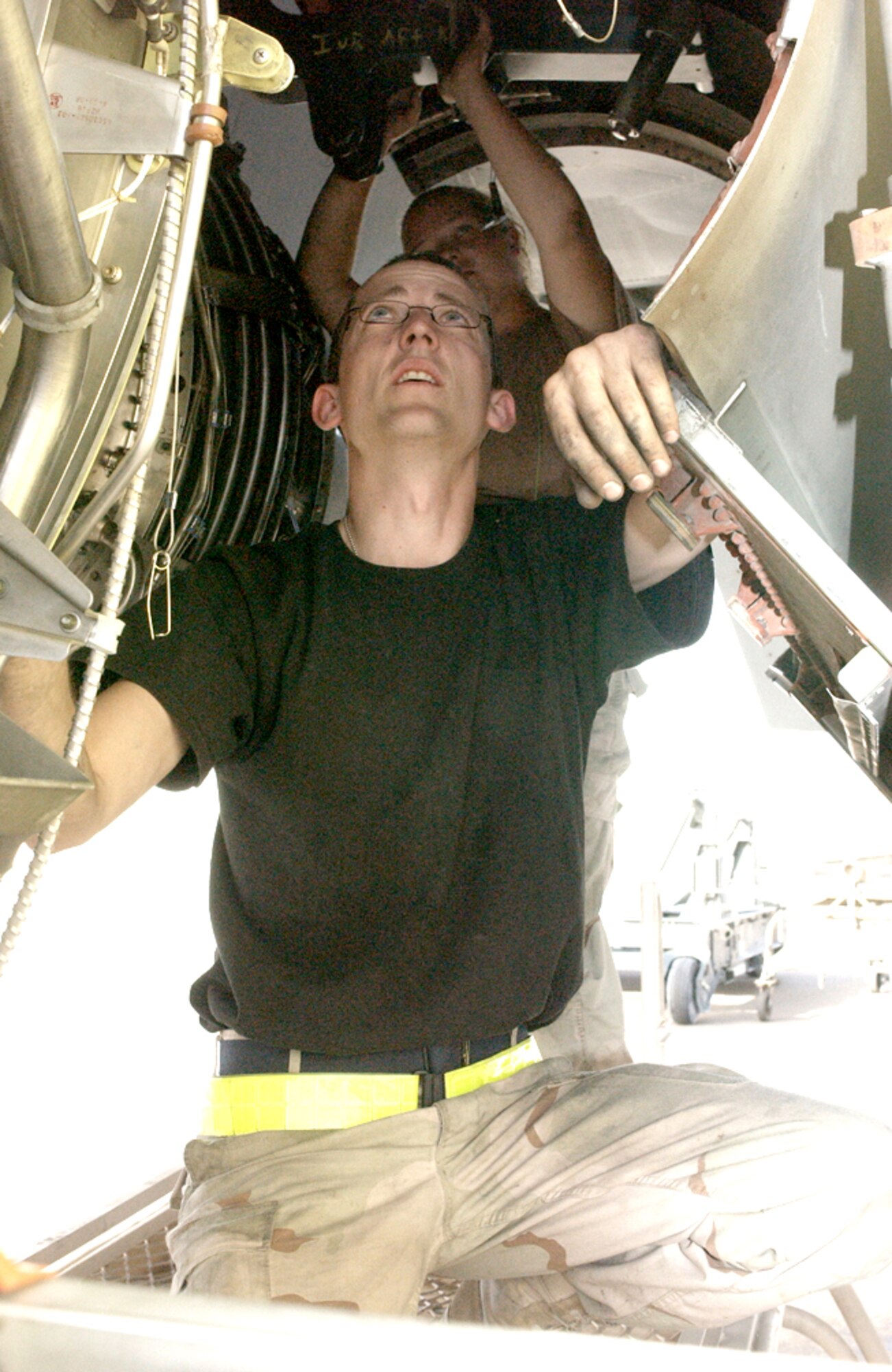SOUTHWEST ASIA -- Staff Sgt. JC Chandler inspects a newly installed engine on a KC-135 Stratotanker at a forward-deployed location.  He is deployed with the 380th Expeditionary Aircraft Maintenance Squadron.  (U.S. Air Force photo by Airman 1st Class Bruce Hedrick) 