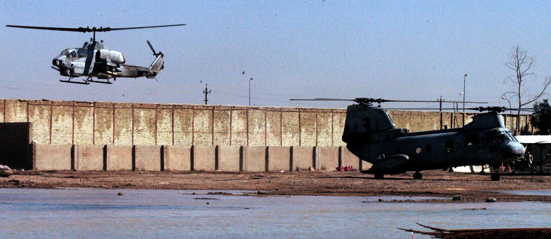 BAGHDAD, Iraq -- (Mar. 15, 2005) -  Both AH-1W Super Cobra and CH-46E Sea Knight helicopters from HMM-165 (REIN) safely land at a Forward Operating Base here.  The 15th Marine Expeditionary Unit (Special Operations Capable) is currently conducting security and stability operations in the greater Baghdad area.  (Official USMC Photo by Capt. Jay Delarosa)
