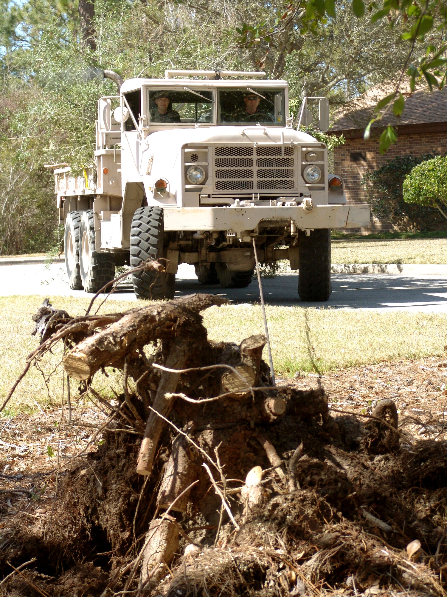 SHALIMAR, Fla. -- Airmen of the 96th Ground Combat Training Squadron used a five-ton truck to pull out stumps from Bob Hope Village here.  The unit used their own equipment to remove 18 stumps and haul tree limbs, saving the village more than $2,000.  Hurricane Ivan downed hundreds of trees on the property and caused more than $300,000 in damage.  (U.S. Air Force photo by Senior Airman Mike Meares)