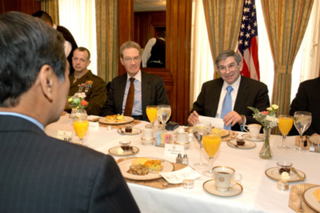 Deputy Secretary of Defense Paul Wolfowitz (right) hosts a breakfast meeting in the Pentagon with Indonesian Minister of Defense Juwono Sudarsono (foreground) on March 15, 2005. A wide range of bilateral security issues are under discussion. Joining Wolfowitz for the talks are Principal Director for the Asia Pacific Region Brig. Gen. John Allen (left), U.S. Marine Corps, and Assistant Secretary of Defense for International Security Affairs Peter Rodman (center). 