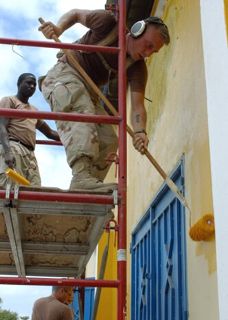 AL ASAD, Iraq -- Corporal Brandon T. Wellman, radar technician with Marine Aviation Logistics Squadron 26 (Reinforced), repairs an electrical harness in an F/A-18A+ Hornet.  Wellman, from Warner Robins, Ga., was recently activated to support the mission of the 2nd Marine Aircraft Wing (Forward) during Operation Iraqi Freedom.